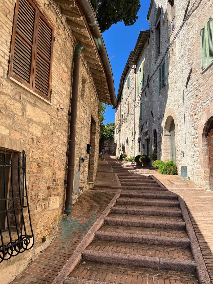 A stone street with steps in Assisi